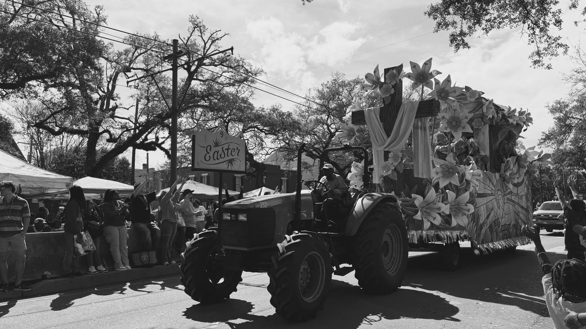 black and white photo of a Rex float called EASTER being pulled buy a tractor